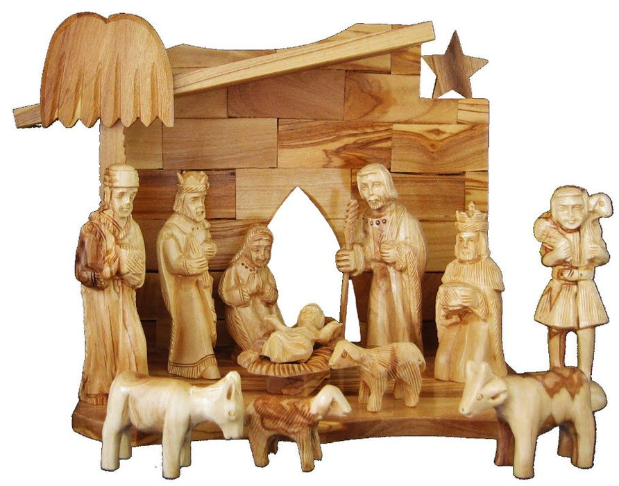 he Holy Family, the Three Wise Men, shepherds, animals, and the baby Jesus in the mange