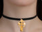 a neck adorned with an olive wood cros